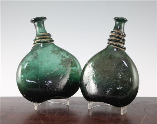 Two Persian green glass saddle flasks, 18th / 19th century, 23cm.